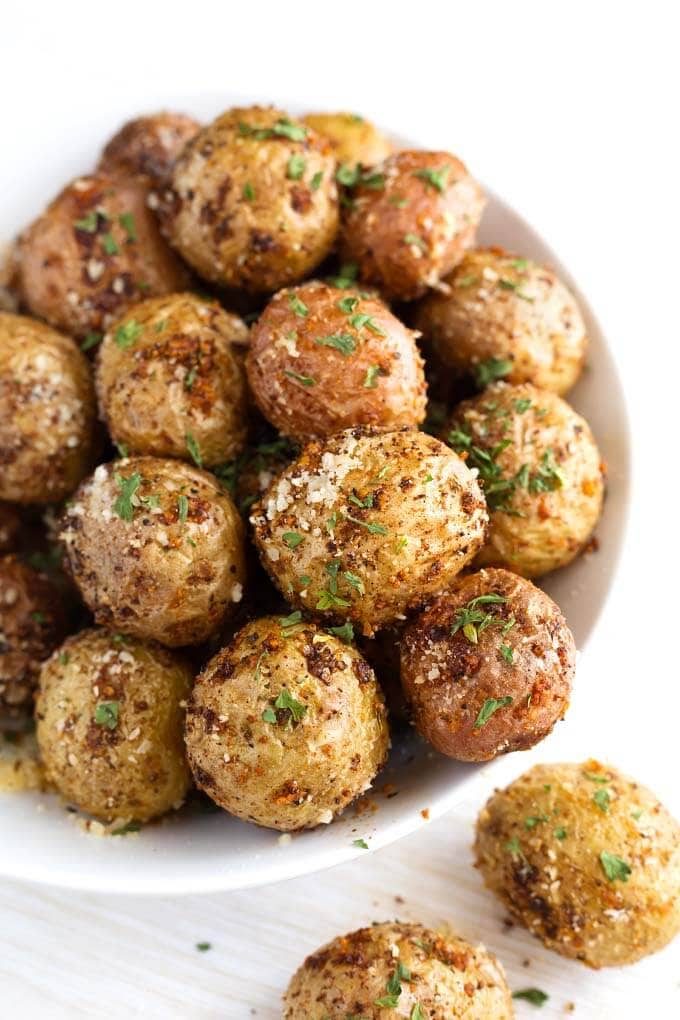 Garlic Parmesan Potatoes with Basil Leaves