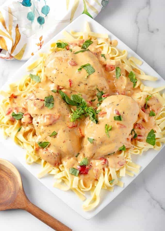 Creamy Cajun Chicken Breasts with Basil Leaves