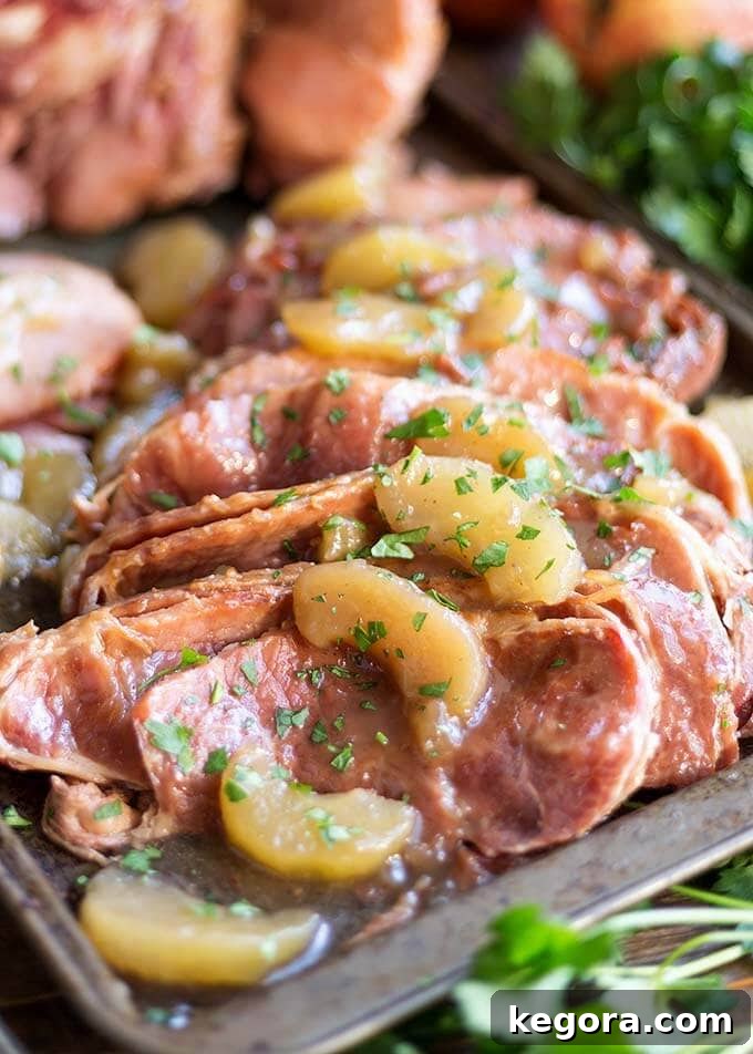 Closeup of sliced Apple Pie Ham on a baking sheet