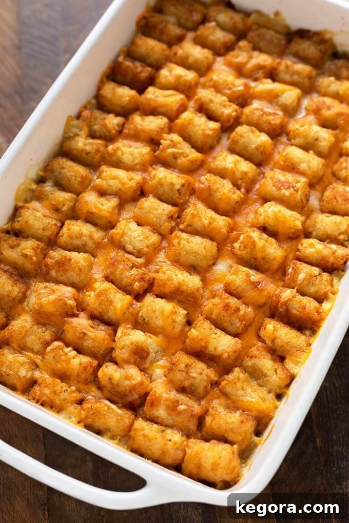 Crispy Tater Tot Comfort Casserole 3 Hotdish Tater Tot Casserole in a white baking dish