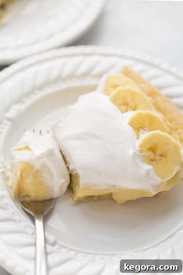 Decadent Gluten-Free Vegan Banana Cream Pie 4 banana cream pie with fork taking bite