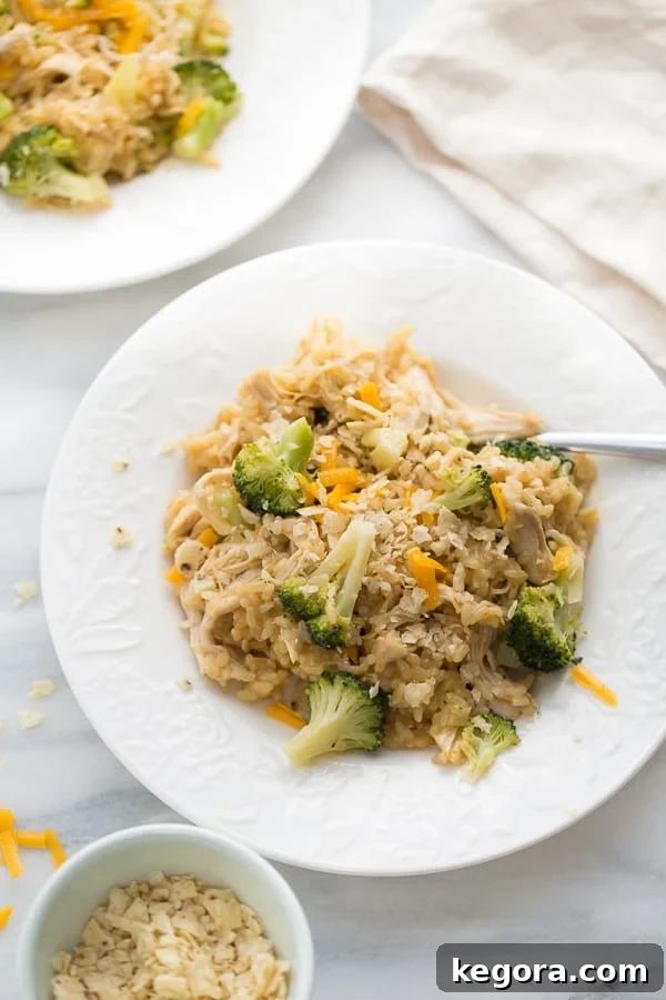 Instant Pot Chicken and Broccoli Rice 5 Instant Pot Chicken Broccoli and Rice in white bowls on a counter