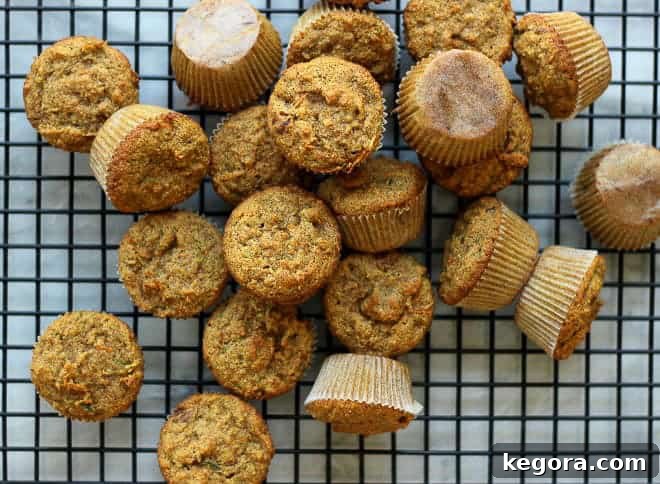 Tiny Taster Carrot Zucchini Muffins 4 A pile of mini toddler muffins with carrots and zucchini.