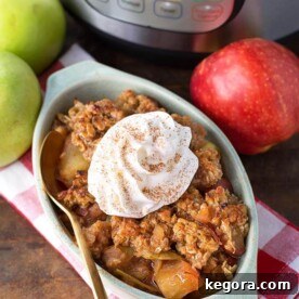 Instant Pot Apple Crisp in a small baking dish, positioned in front of a pressure cooker.