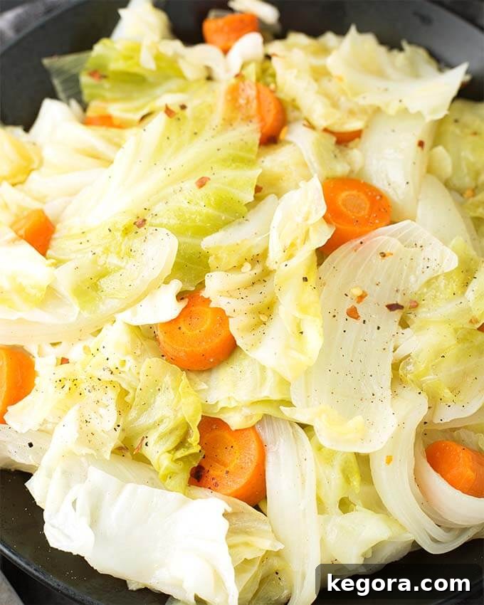 Pressure Cooker Cabbage Perfection 3 Close-up view of the tender, perfectly cooked Cabbage Side Dish served in a sleek black bowl, showcasing its inviting texture and appetizing appeal.