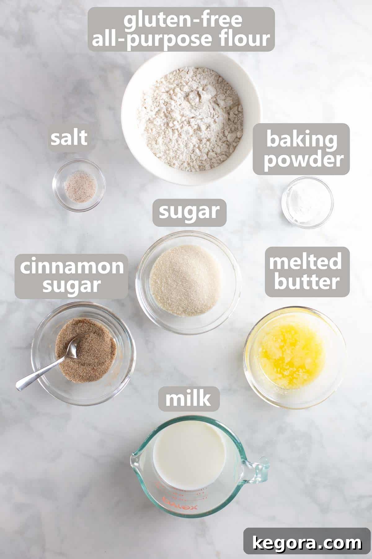Bowls of gluten-free flour, sugar, baking powder, salt, milk, and melted butter, ready for the cobbler topping.