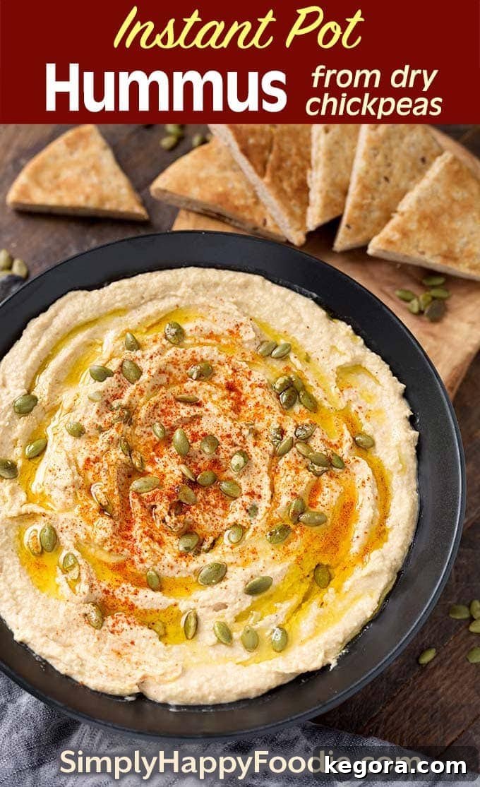 Instant Pot Hummus in black bowl as well as the title and Simply Happy Foodie.com logo, ready for Pinterest