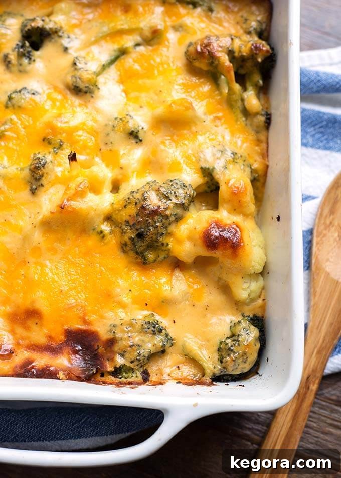 Quick & Easy Instant Pot Broccoli Cauliflower Cheese Bake 3 Closeup of Broccoli Cauliflower Cheese Bake in white baking dish