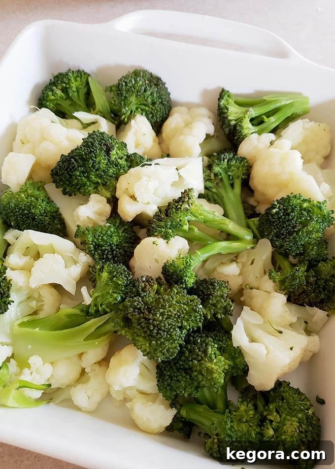 Quick & Easy Instant Pot Broccoli Cauliflower Cheese Bake 5 broccoli and cauliflower in a white baking dish