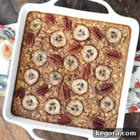 Warm Banana Bread Oatmeal Bake 7 Banana Bread Baked Oatmeal in a white square baking dish