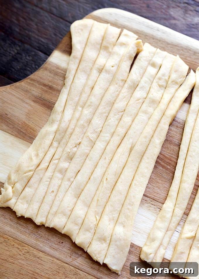 Fright Night Frank Wraps 4 Long Cut strips of dough on wooden board