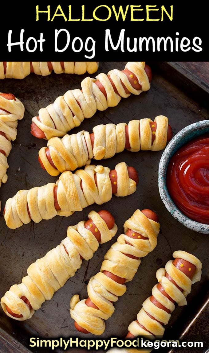 Fright Night Frank Wraps 8 Halloween Hot Dog Mummies on baking sheet with title and simply happy foodie.com logo