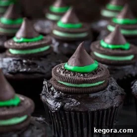Halloween Witch Hat Cupcakes on dark wood board