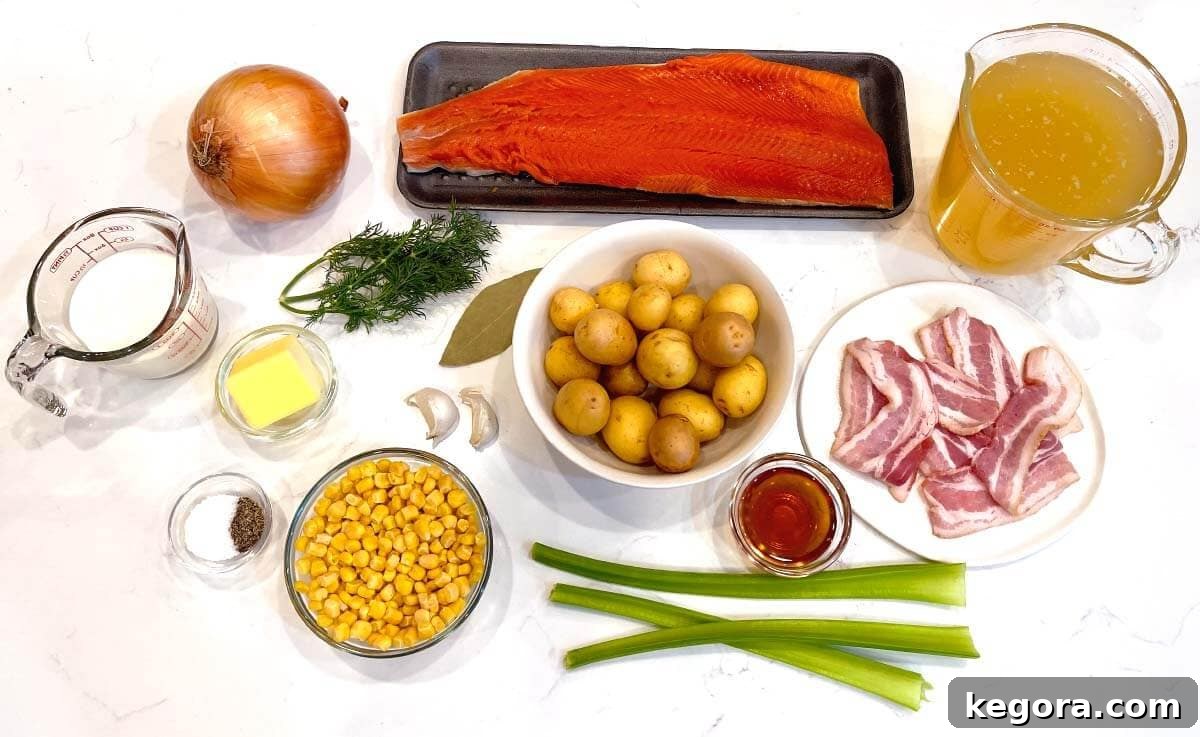 Artisan Salmon Chowder 4 A vibrant flat lay of all the fresh ingredients for Salmon Chowder, including salmon fillets, bacon, potatoes, corn, dill, and cream.