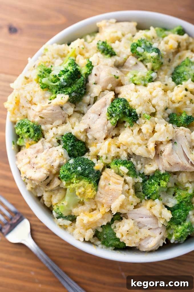 Delicious and creamy Instant Pot Chicken Broccoli Rice Casserole served on a white plate on a rustic wooden background