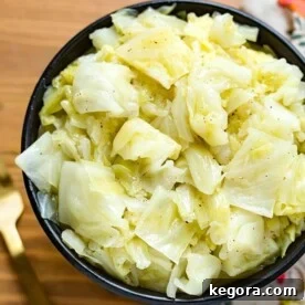 Perfect Instant Pot Buttered Cabbage 5 Buttered Cabbage in a black bowl on wooden surface