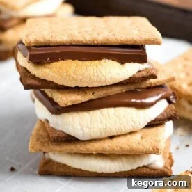 Indoor Oven S'mores stacked on a baking sheet, showcasing the finished dessert