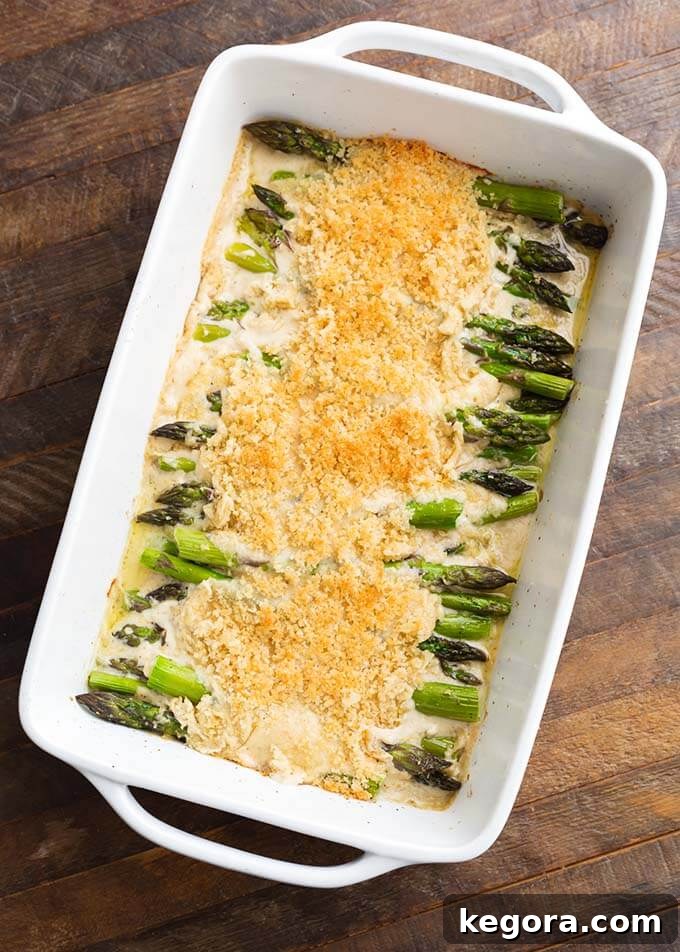 Velvety Baked Asparagus Alfredo 2 Creamy Baked Asparagus Alfredo in white baking dish