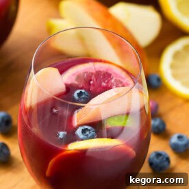 Vibrant Red Fruit Sangria 4 Fruity Red Sangria in a stemless wineglass