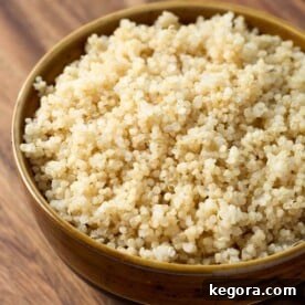 Easy Instant Pot Quinoa in brown bowl, part of recipe card