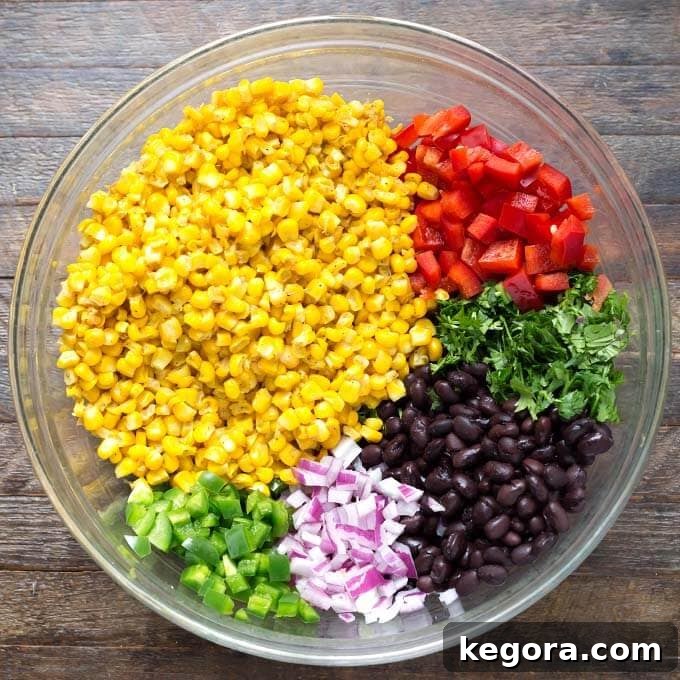 Elote Fiesta Salad 3 Ingredients for Mexican Street Corn Salad in a glass bowl