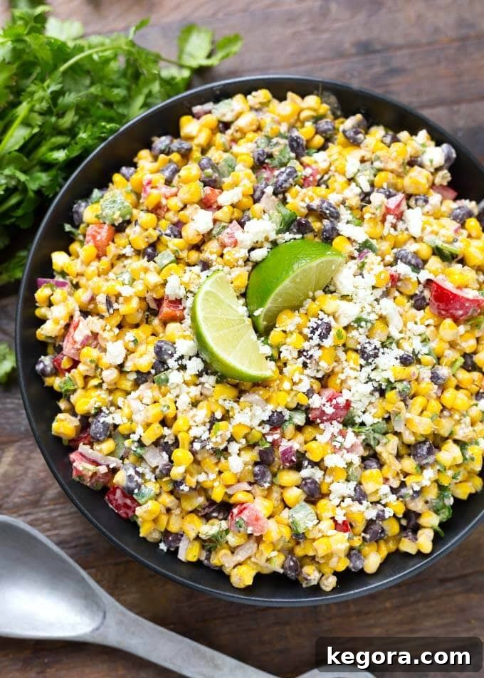 Elote Fiesta Salad 5 Mexican Street Corn Salad in a black bowl on a wooden surface