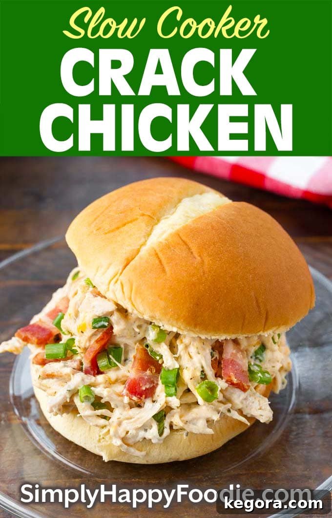 Slow Cooker Crack Chicken on a bun as well as title and Simply Happy Foodie.com logo, perfect for Pinterest