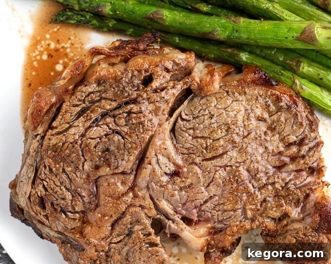 Perfect Air Fryer Ribeye Steak 4 Air Fryer Rib Eye Steak and asparagus on white plate