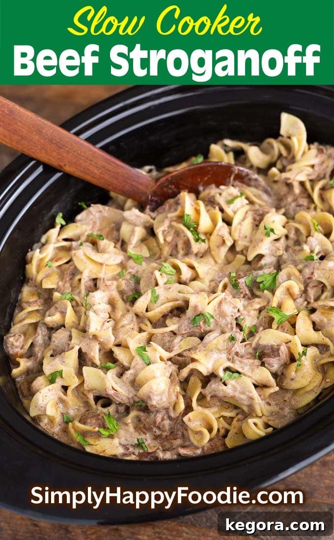 Creamy Slow Cooker Beef Stroganoff 5 Slow Cooker Beef Stroganoff with title and Simply Happy Foodie.com logo on a vertical pin-friendly image.