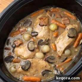 Effortless Slow Cooker Coq Au Vin 6 Coq Au Vin in Slow Cooker, ready to be served, showcasing the delicious chicken and vegetables.