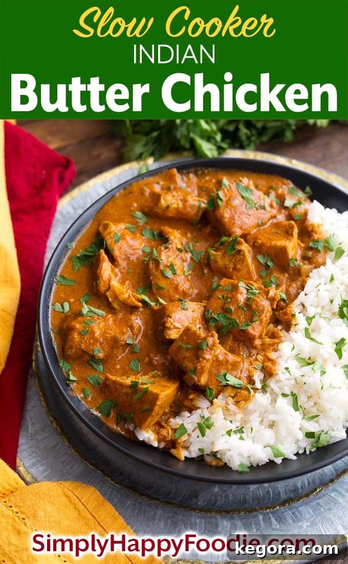 Slow Cooker Indian Butter Chicken served with rice on a black plate, a perfect image for Pinterest.