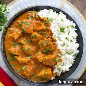 Slow Cooker Indian Butter Chicken served with rice.