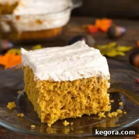 Spiced Pumpkin Cake with Cinnamon Butterscotch Frosting 8 Pumpkin Cake with Cinnamon Butterscotch Frosting on glass plate