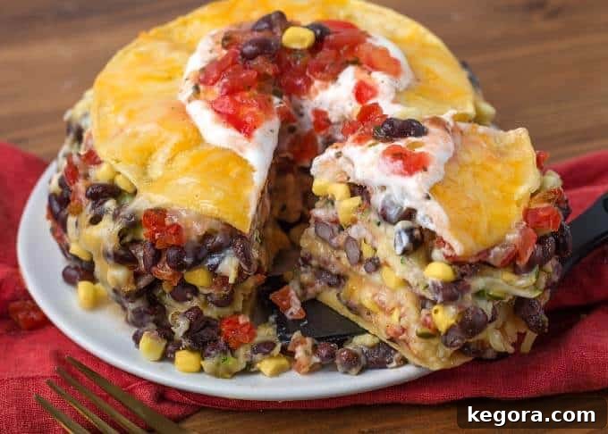 Beautifully garnished Instant Pot Veggie Tortilla Pie on a plate, ready to be served