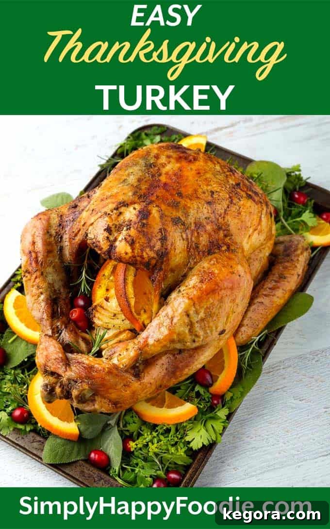 Effortless Thanksgiving Turkey 12 Thanksgiving Turkey on baking sheet with vegetables, herbs, sliced oranges and cranberries as well as title and Simply Happy Foodie.com logo