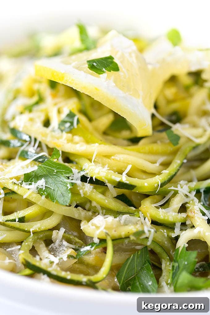 Zesty Lemon Garlic Zucchini Noodles 3 close up of Lemon Garlic Zucchini Noodles in a white bowl