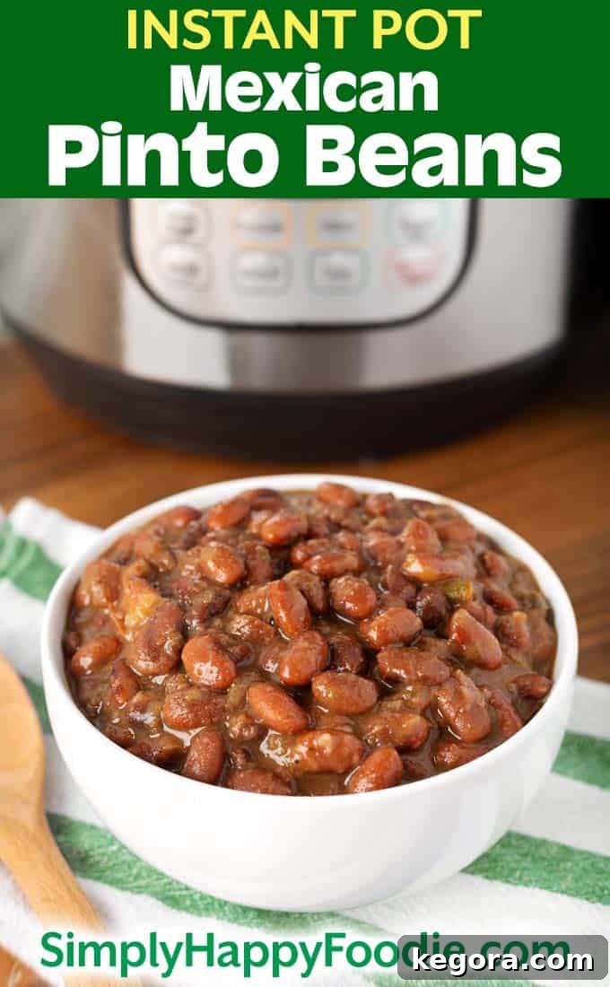 Instant Pot Mexican Pinto Beans in white bowl with title and simply happy foodie.com logo