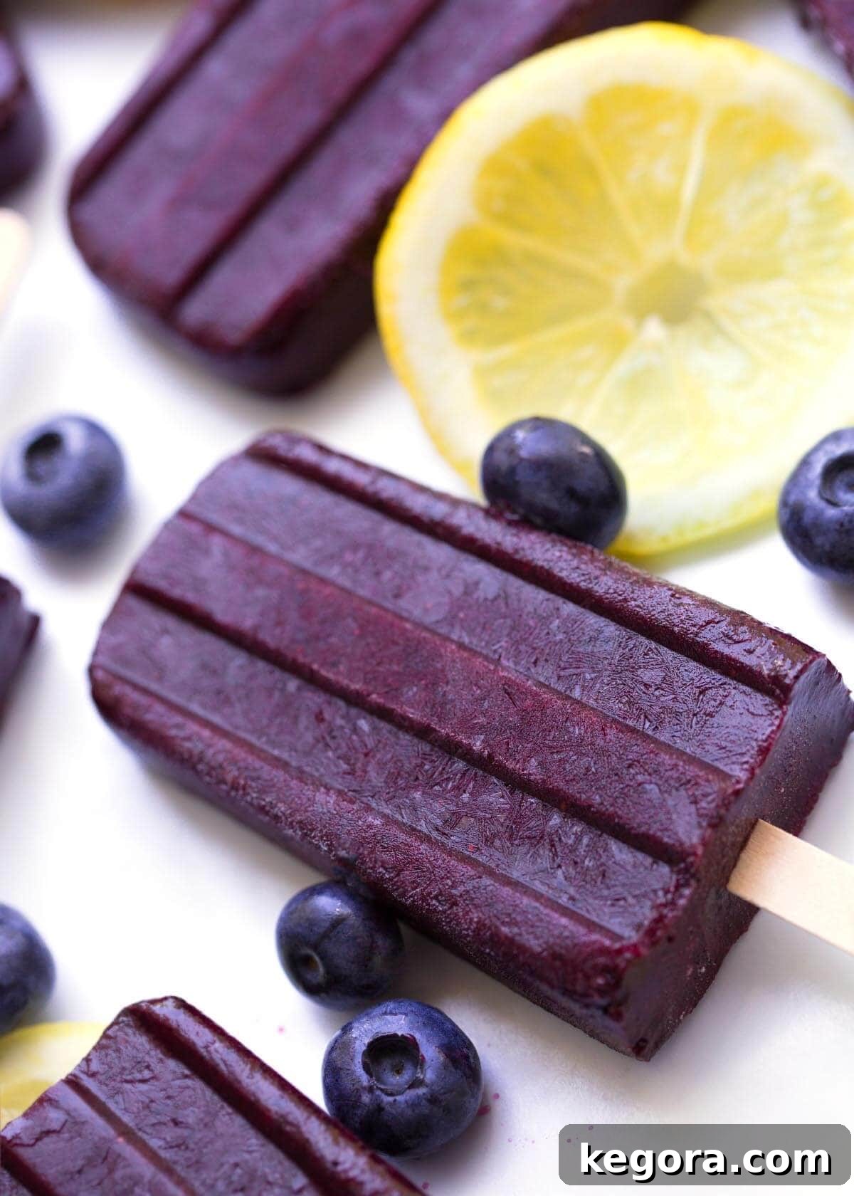 Sun-Kissed Berry Lemon Freezes 4 Blueberry Lemon Popsicles on a white background
