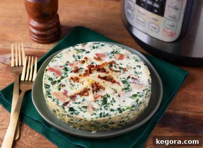 Instant Pot Savory Spinach Bacon Egg Bake 3 Whole Instant Pot Spinach Bacon Crustless Quiche on a serving plate next to two forks