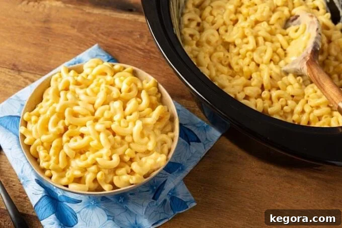Slow-Cooked Cheesy Perfection 3 Mac and Cheese in a crock and in a bowl, ready to be served