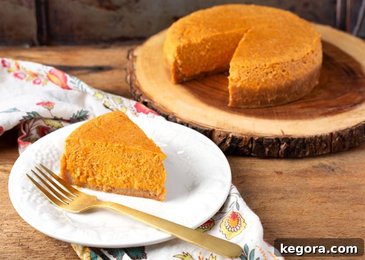 Effortless Instant Pot Sweet Potato Pie 10 A slice of Instant Pot Sweet Potato Pie on a white plate, ready to be eaten.