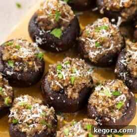 Irresistible Garlic Stuffed Mushrooms 5 Garlic Stuffed Mushrooms on a board