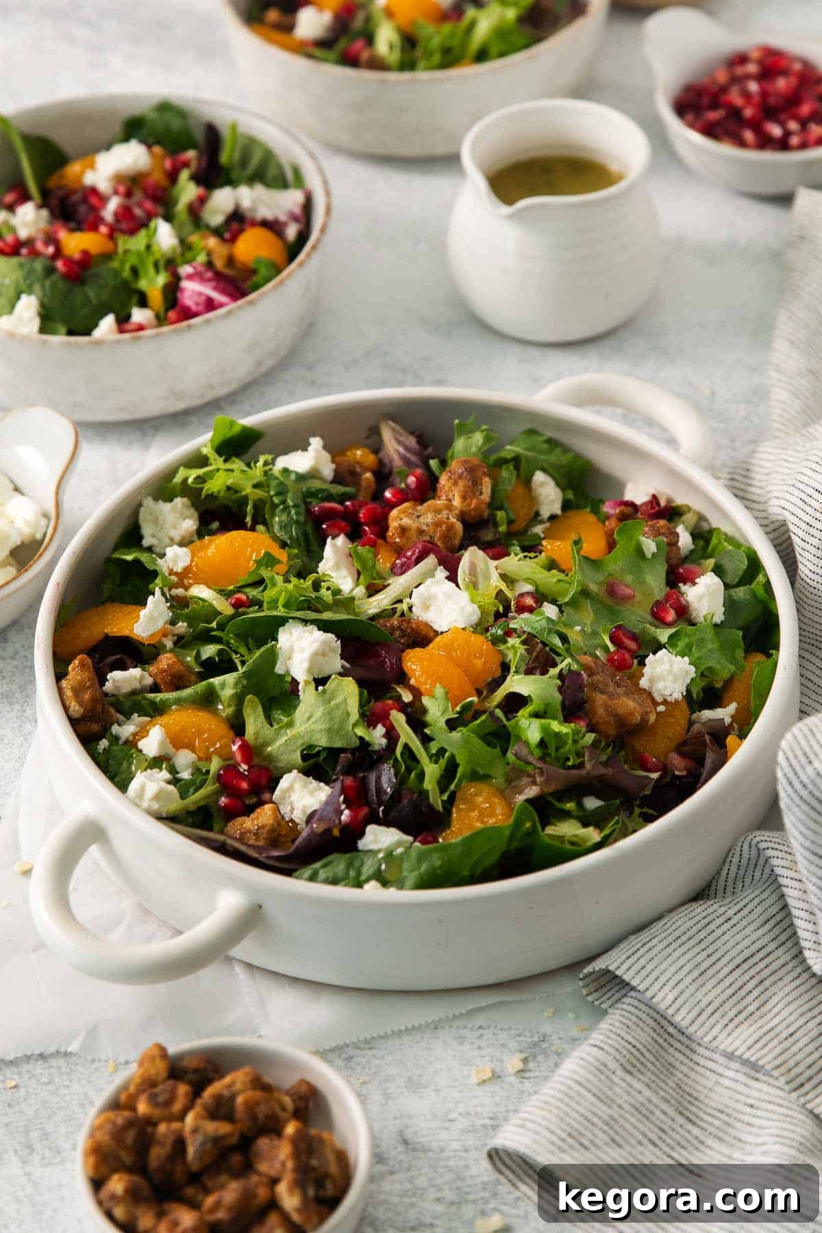 Autumn Harvest Green Salad 2 Thanksgiving green salad in a bowl on a table, showcasing fresh ingredients