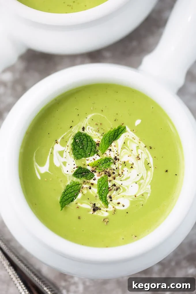Minty Pea Soup in small white bowl with handle