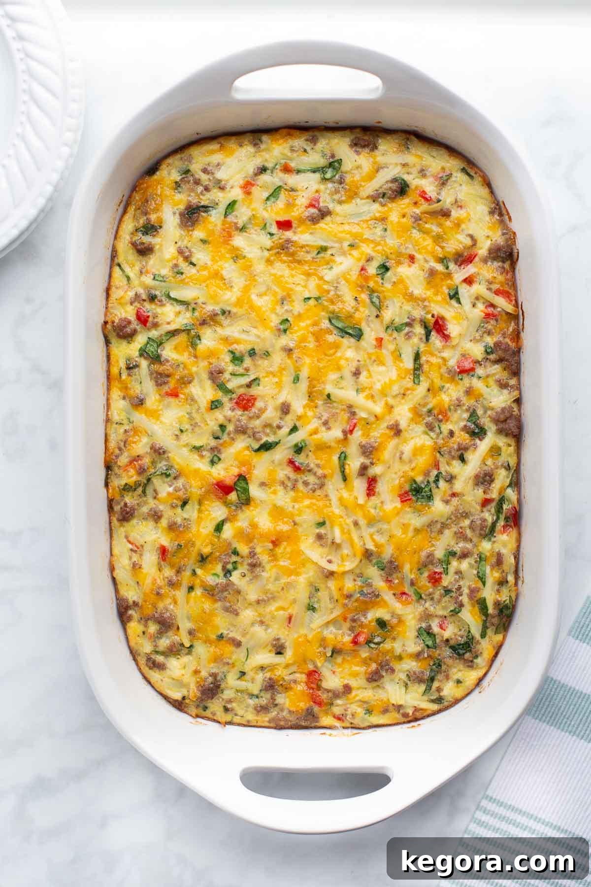 overhead shot of breakfast casserole in white casserole dish.