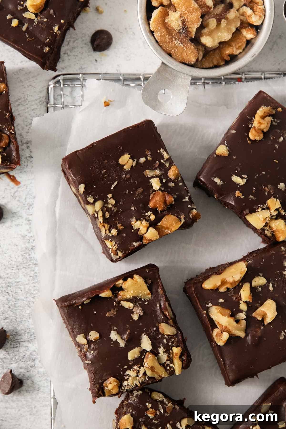 Simple Vegan Fudge 2 Close-up of creamy dairy-free fudge squares arranged on parchment paper, ready to be enjoyed.