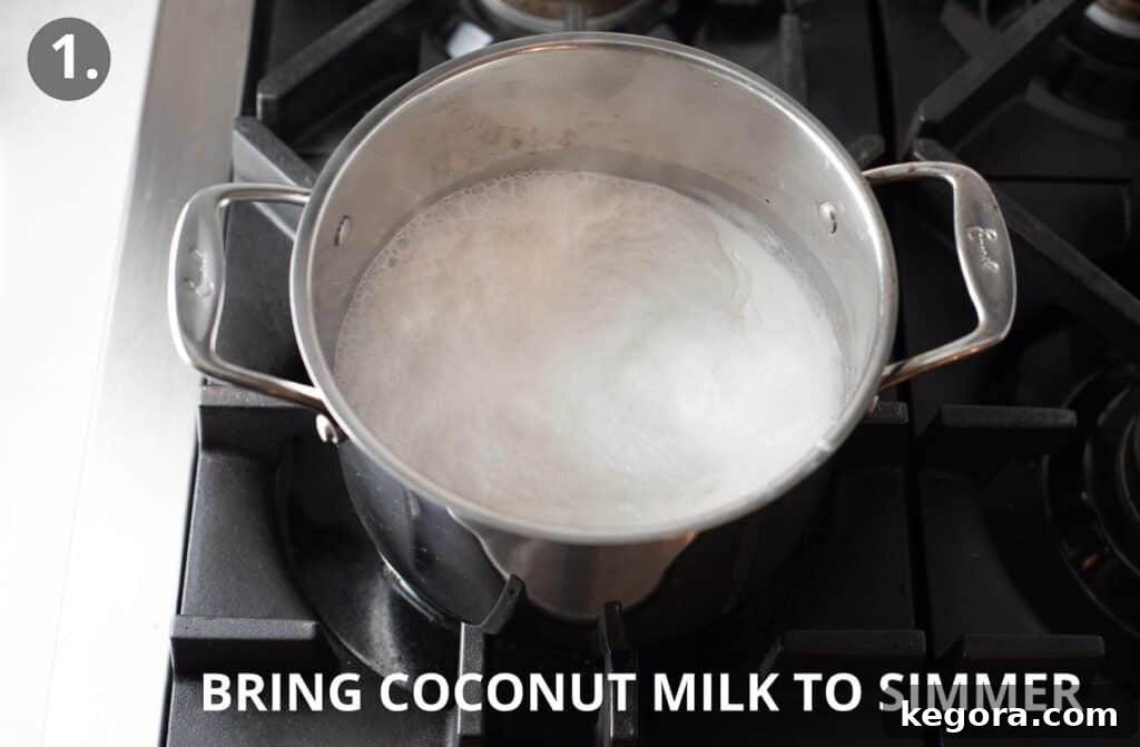 Simple Vegan Fudge 4 Full-fat coconut milk being poured into a metal saucepan, ready to be heated and simmered on the stovetop.