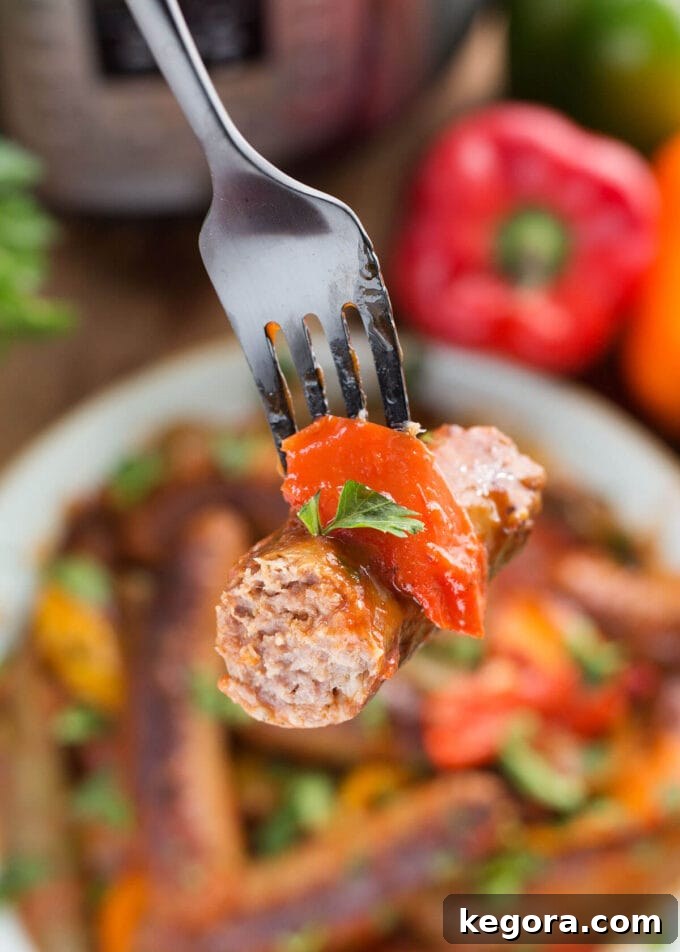 a half sausage on the end of a fork, close up