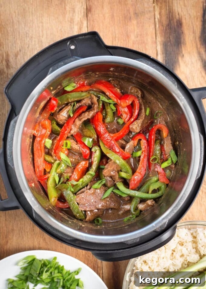 Instant Pot Pepper Steak in the pot from a top-down view