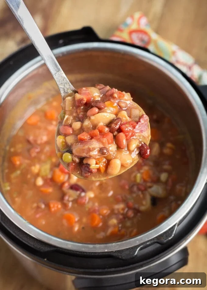 Hearty Instant Pot 15 Bean Soup 6 Instant Pot 15 Bean Soup in pot with a ladle full